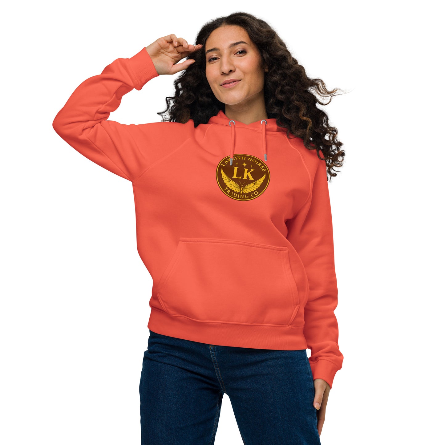 Model wearing burnt orange LaKeith Noirée unisex eco raglan hoodie with logo