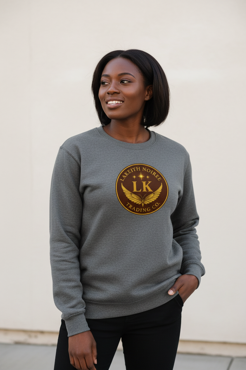 African American woman wearing carbon grey LaKeith Noirée unisex premium sweatshirt with LKTC logo centered on chest