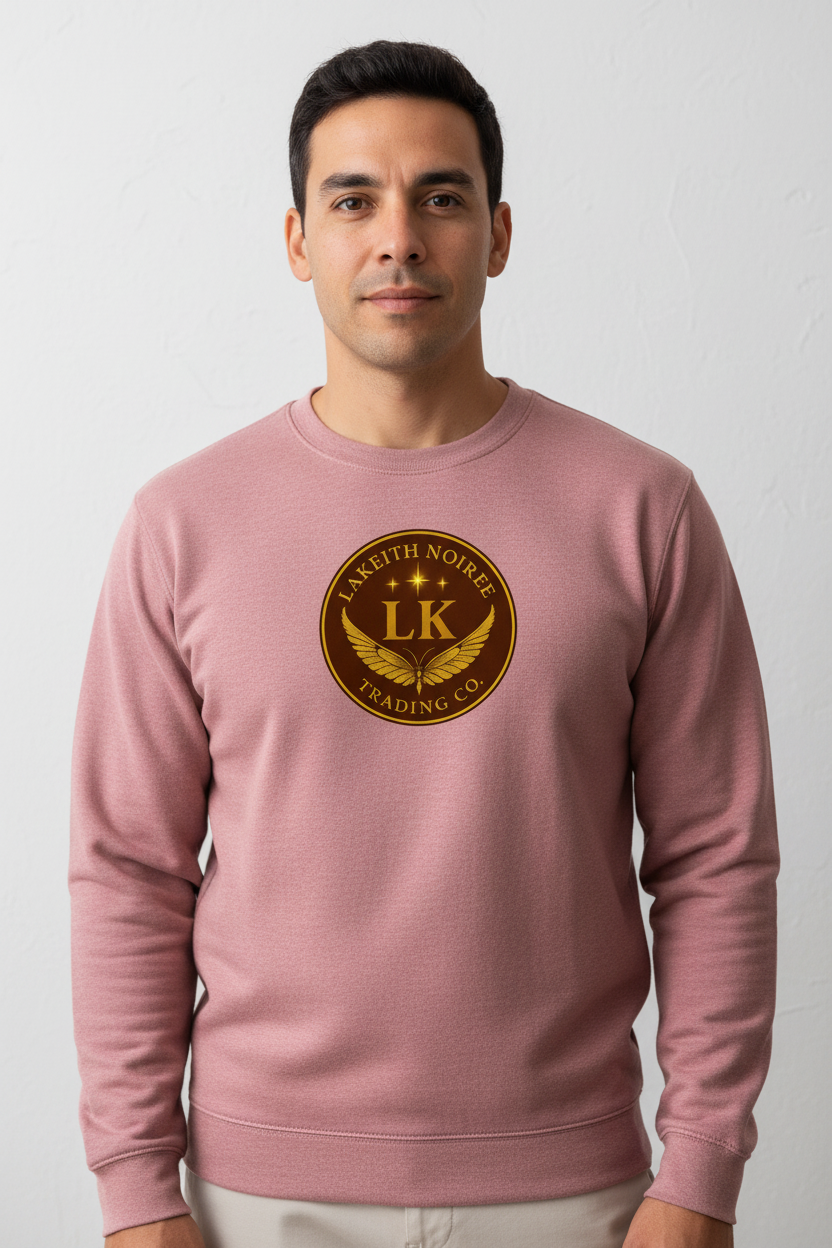 Latino man wearing dusty rose LaKeith Noirée unisex premium sweatshirt with LKTC logo centered on chest