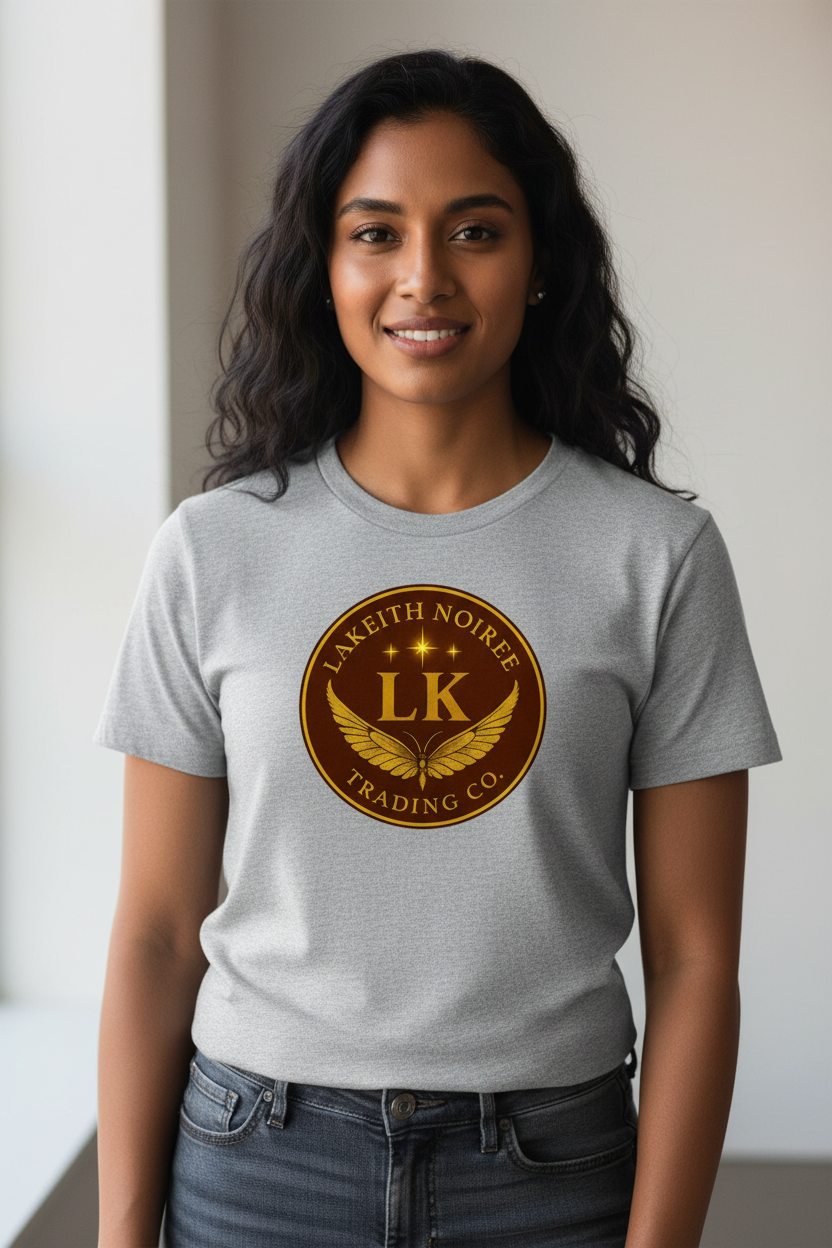South Asian woman wearing heather grey LaKeith Noirée unisex organic cotton t-shirt with LKTC logo centered on chest